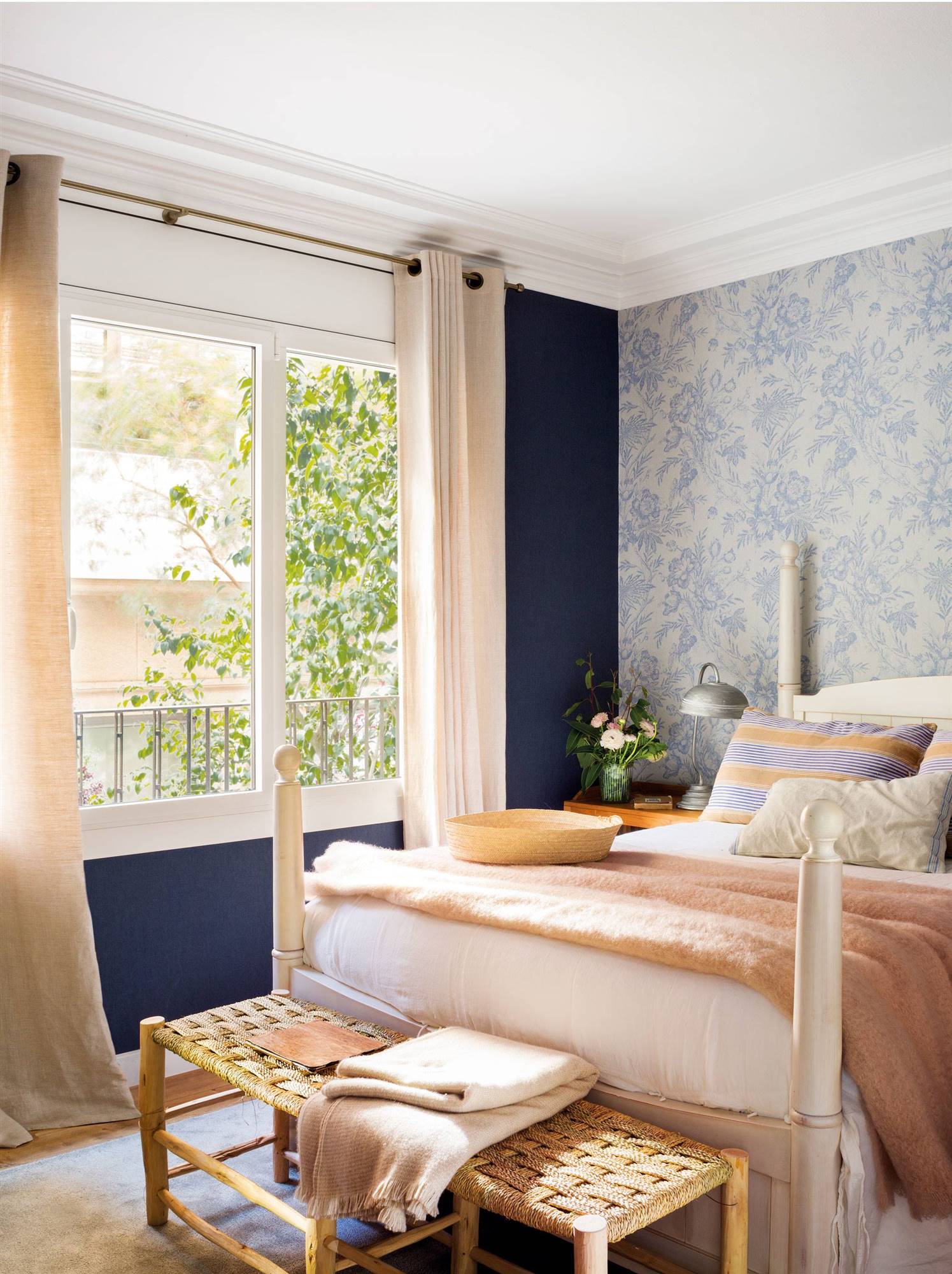 Bedroom with blue walls and wallpaper