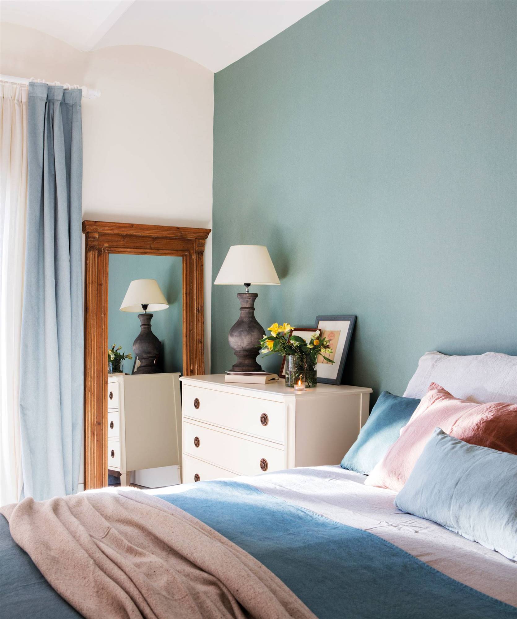Bedroom with blue headboard wall